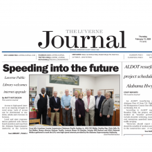 Thumbnail Image of Article in The Luverne Journal showing group of men and women in standing in library