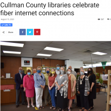 Thumbnail Image of group of men and women standing in library