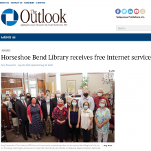 Thumbnail Image of group of men and women standing in library