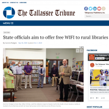 Thumbnail Image of a group of people standing in the library.