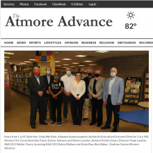 Thumbnail Image of group of men and women standing in library