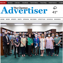 Thumbnail Image of group of 17 men and women standing in library