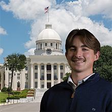 Photo of Brody Dean with Alabama state capitol in background