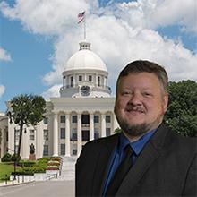 Photo of Brad Watts with Alabama state capitol in background