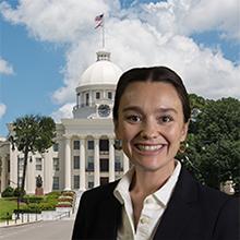 Photo of Courtney Maranda Rozar with Alabama state capitol in background
