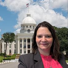 Photo of Crystal Maylin Jesse with Alabama state capitol in background