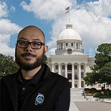 Photo of Dexter Lessner-Cavillo with Alabama state capitol in background