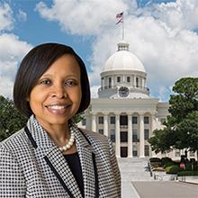 Photo of Nichole Gipson with Alabama state capitol in background