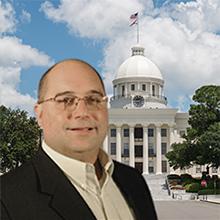 Photo of Rick Bagwell with Alabama state capitol in background